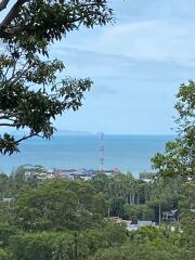 Scenic view of ocean and greenery