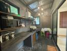 Industrial style kitchen with modern appliances and open shelving