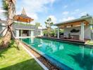 Luxury outdoor pool area with patio and tropical landscaping