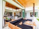 Spacious indoor-outdoor living area with modern furnishings and expansive sliding doors