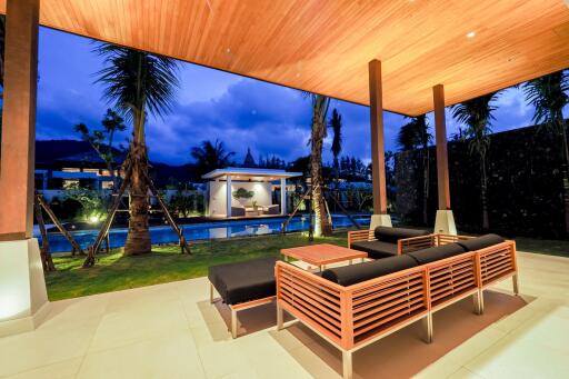 Covered outdoor seating area with pool view