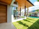 Outdoor area with pool view and partially covered patio