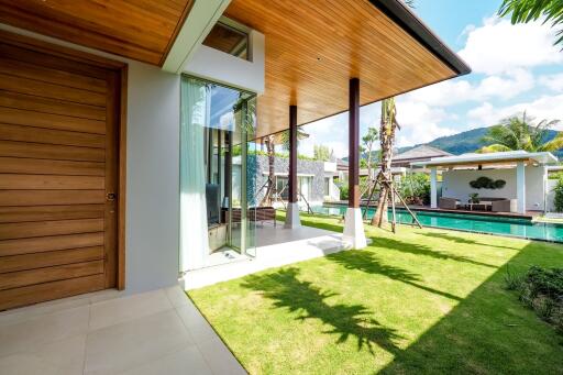 Outdoor area with pool view and partially covered patio