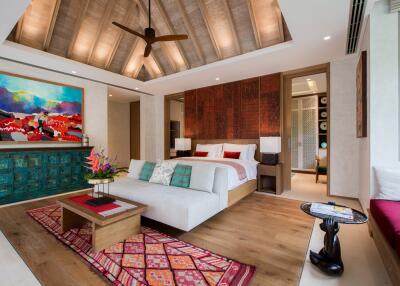 Spacious modern bedroom with unique decor and vibrant artwork