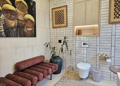 Modern bathroom with artwork and plants