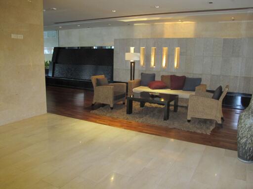 Modern living room with seating area and decorative lighting