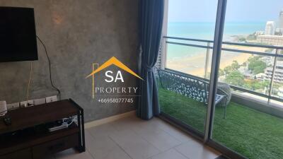 Living room with a view of the sea and balcony access