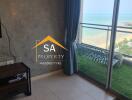 Living room with a view of the sea and balcony access