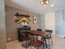 Modern dining area with wooden table and chairs