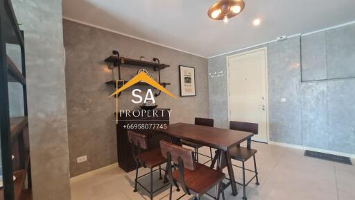 Modern dining area with wooden table and chairs