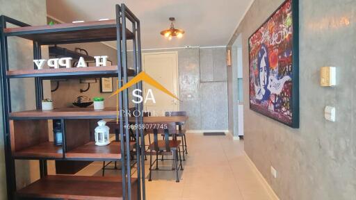 Modern dining area with wall art and shelving