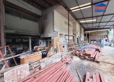 Exterior view of a construction site with scattered building materials