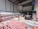 Construction site of a building with materials and tools scattered around.