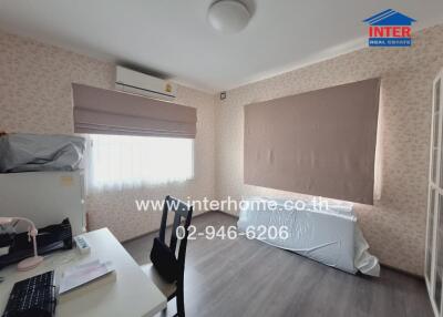 Bedroom with desk and air conditioning