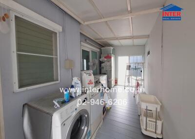 Covered laundry area in a residential house