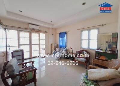 Living room with furniture and large windows