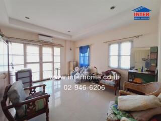 Living room with furniture and large windows