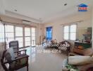 Living room with furniture and large windows