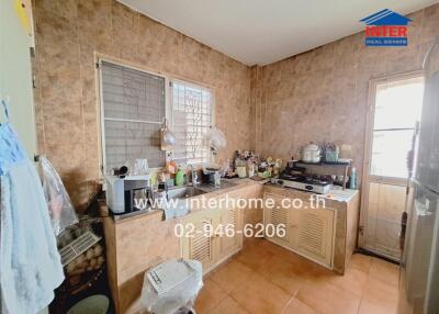 A well-used kitchen with various appliances and utensils