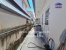 Narrow outdoor utility area with washing machine