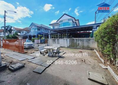 Front view of a residential property with driveway and front yard