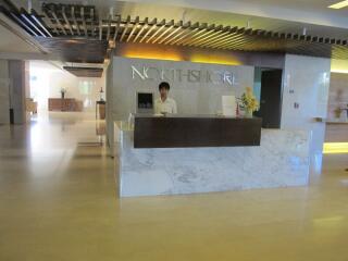 Reception area with marble counter and wall sign