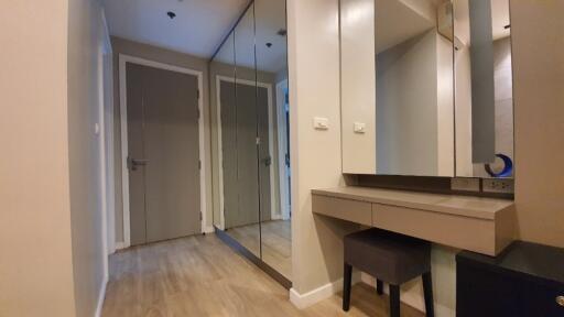 Hallway with built-in mirror wardrobe and vanity desk