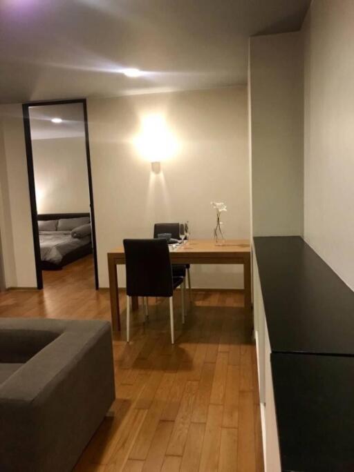 Modern dining area with wooden table and chairs