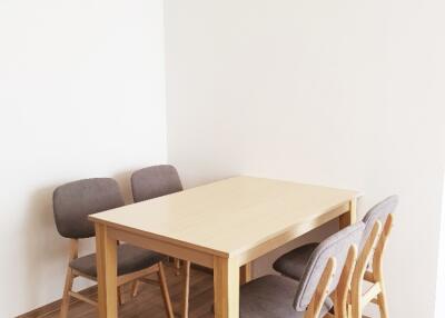 cozy dining area with wooden table and chairs