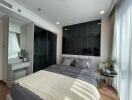 Modern bedroom with a large window and natural light