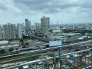 View from a high-rise balcony overlooking the cityscape