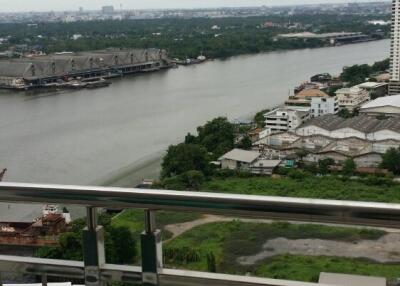 View from the balcony overlooking a river and cityscape