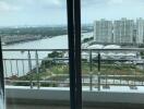 Balcony with a view of river and buildings