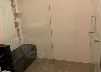 Modern bathroom with glass-enclosed shower