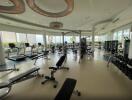 Spacious modern gym with various fitness equipment