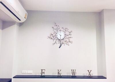 Living room with clock and decorative letters