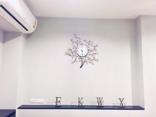 Living room with clock and decorative letters