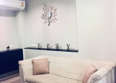 Living room with sofa and wall art