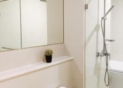 Modern bathroom with glass shower enclosure and vanity