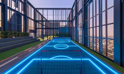 Modern outdoor recreational area with a sports court and goalposts