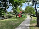 Outdoor playground area with slide and greenery