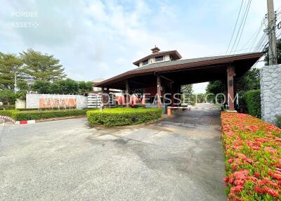 Entrance of a residential property with a gated security checkpoint