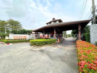 Entrance of a residential property with a gated security checkpoint