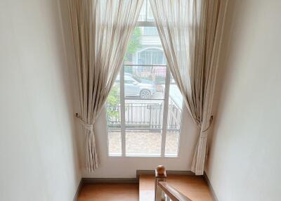 Staircase with window and curtains