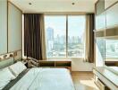 Modern bedroom with large window and city view