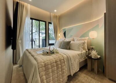 Modern bedroom with elegant decor and large window