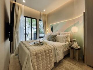 Modern bedroom with elegant decor and large window