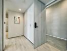 Modern hallway with light wood flooring and artwork