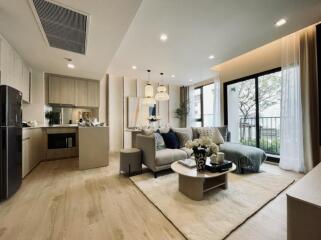 Modern open-concept living area with kitchen, living room, and dining space