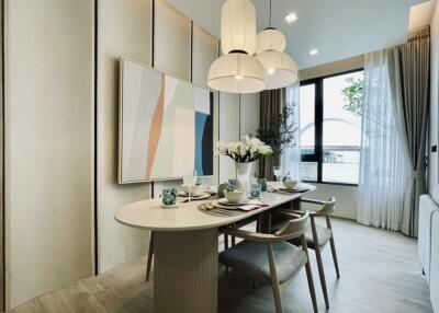 Modern dining area with table, chairs, and decorative elements